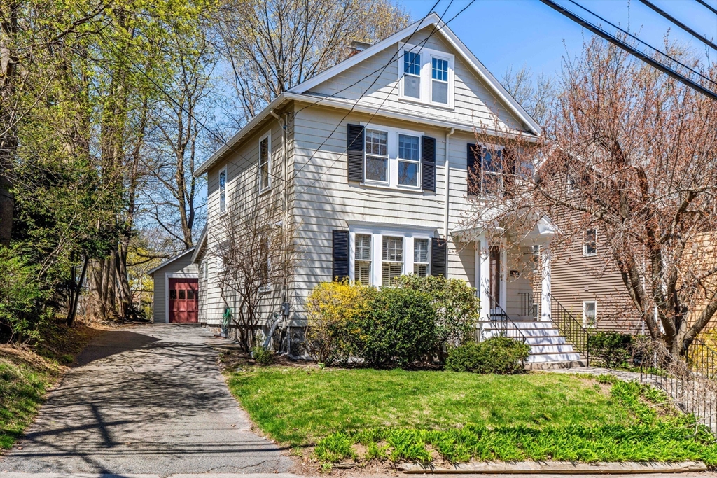 156 Russett Road Boston, MA 02132 - Photo 1 of 32 a front view of a house with a yard