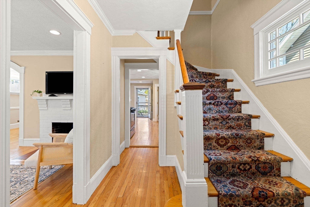 156 Russett Road Boston, MA 02132 - Photo 12 of 32 a view of a livingroom with wooden floor and entryway