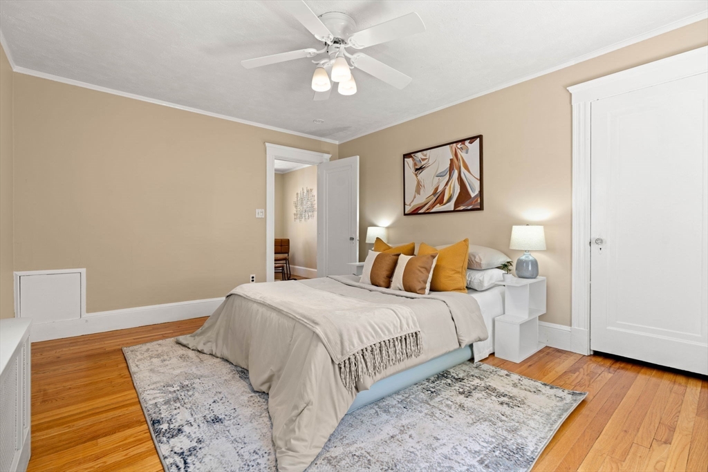 156 Russett Road Boston, MA 02132 - Photo 18 of 32 a bedroom with a large bed and a rug