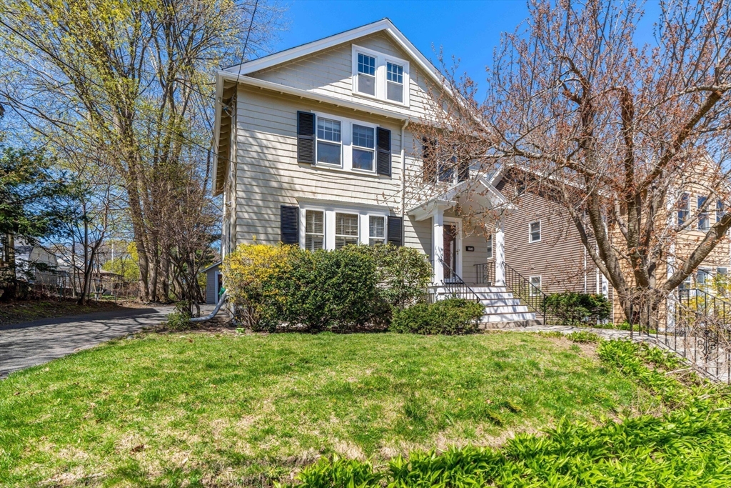 156 Russett Road Boston, MA 02132 - Photo 2 of 32 a front view of a house with a yard