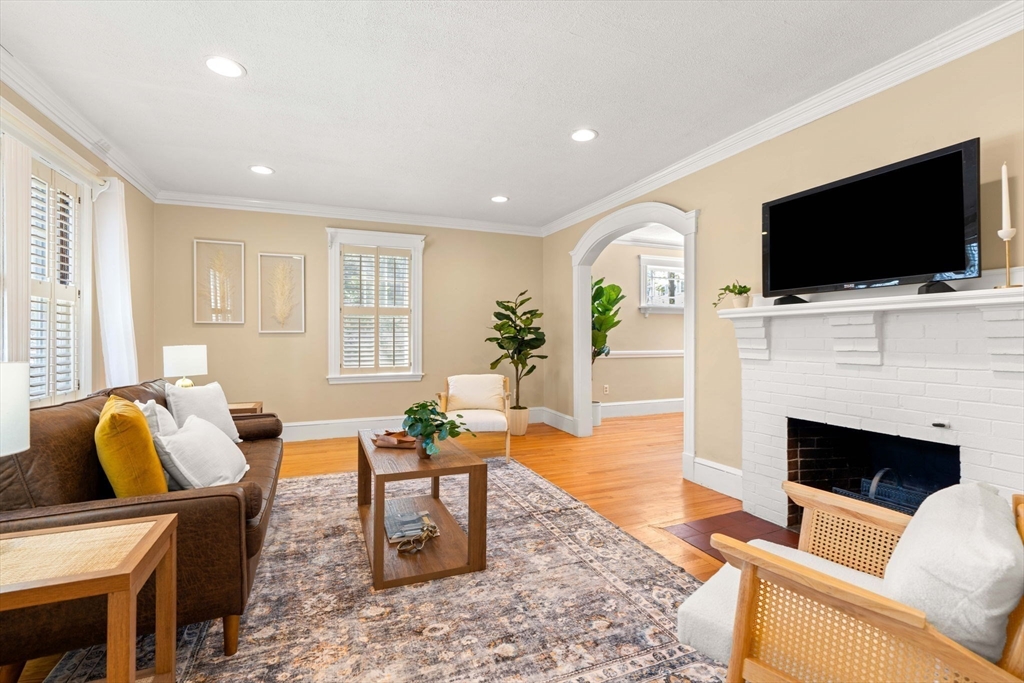 156 Russett Road Boston, MA 02132 - Photo 4 of 32 a living room with fireplace furniture and a flat screen tv