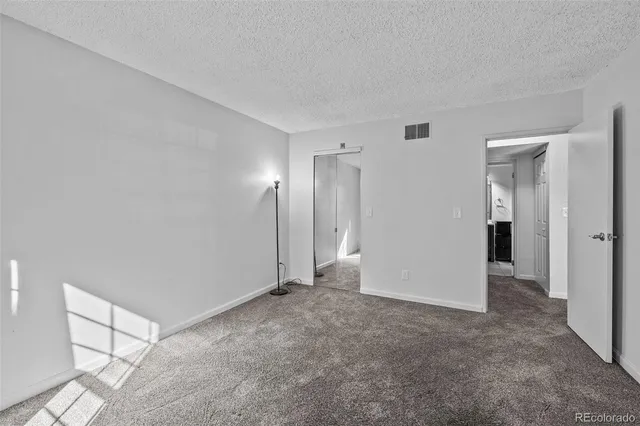 a small space with racks on the wall