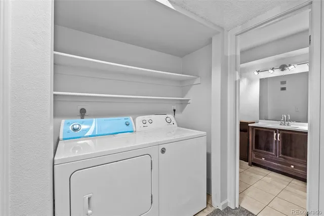 a bathroom with a sink vanity toilet and shower