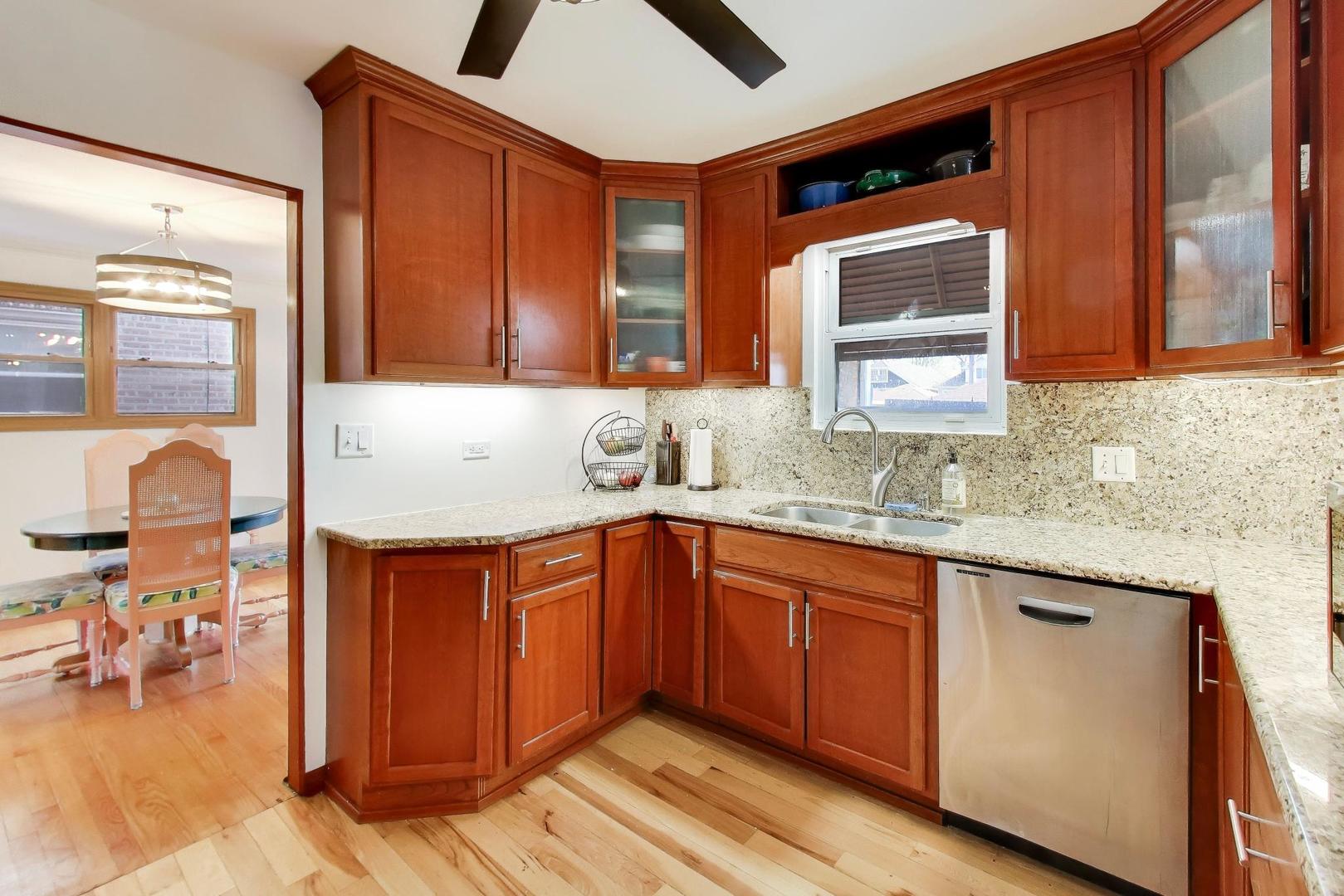1811 Maple Avenue Berwyn, IL 60402 - Photo 11 of 31 a bathroom with a granite countertop sink and a mirror