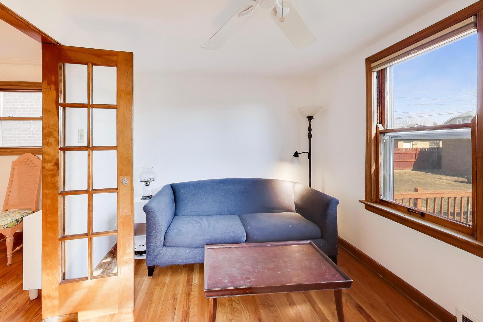 1811 Maple Avenue Berwyn, IL 60402 - Photo 14 of 31 a living room with furniture and a window
