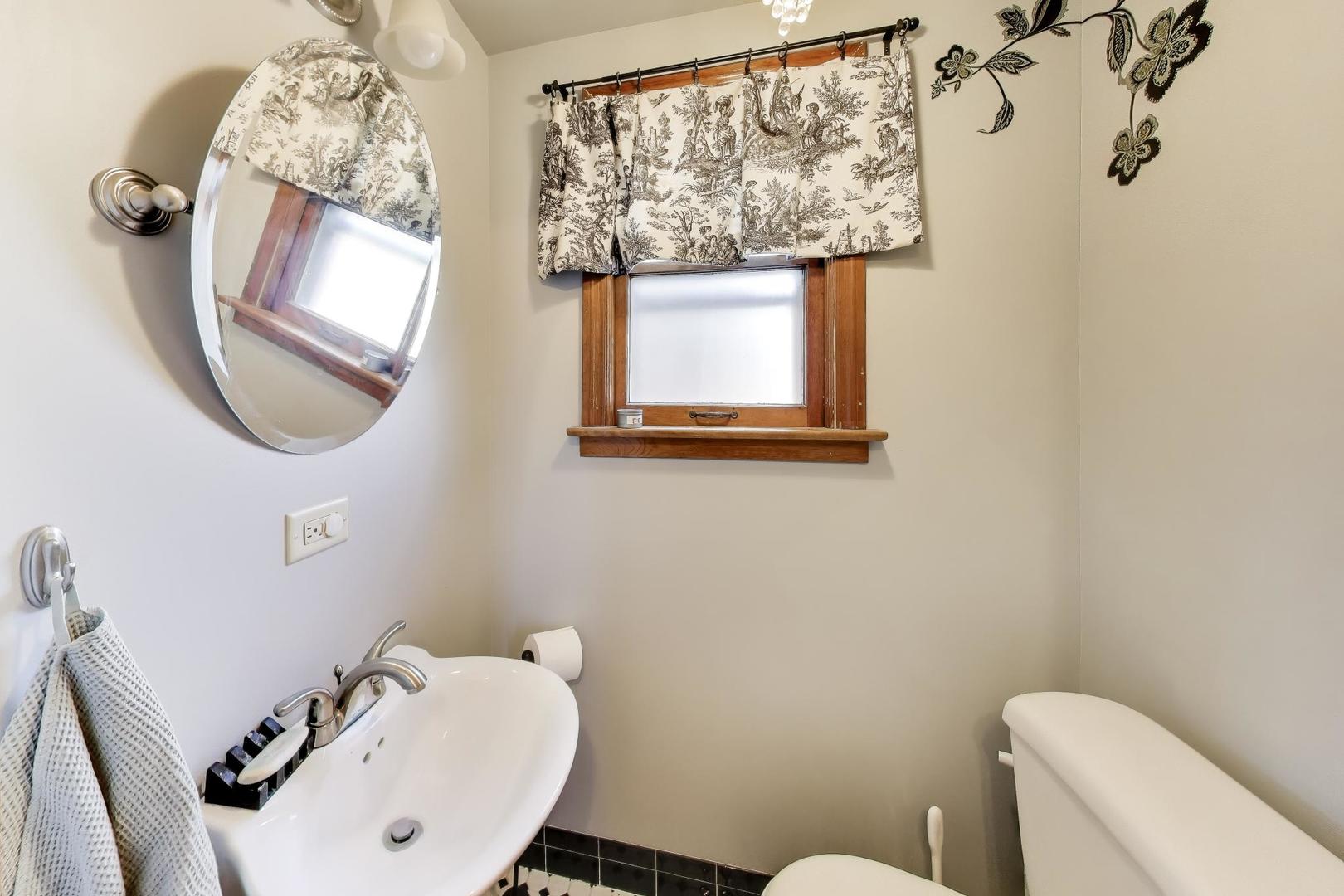 1811 Maple Avenue Berwyn, IL 60402 - Photo 16 of 31 a bathroom with a toilet and a sink