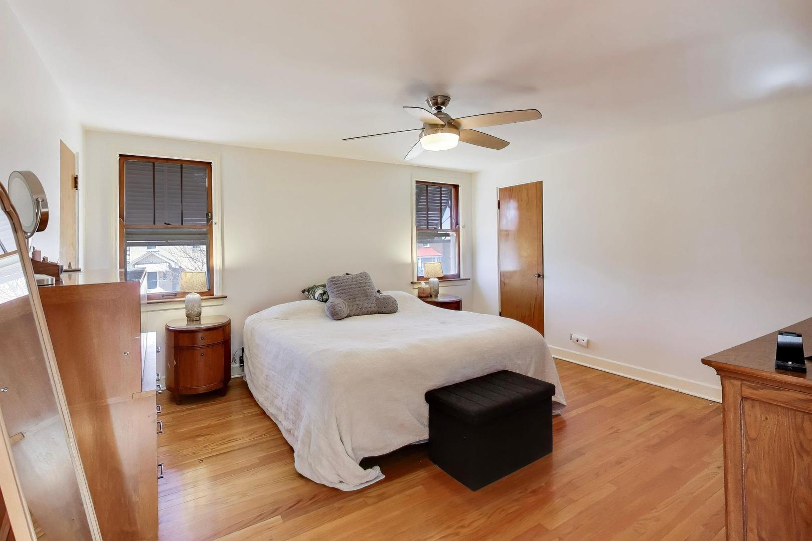 1811 Maple Avenue Berwyn, IL 60402 - Photo 17 of 31 a bedroom with a bed and wooden floor
