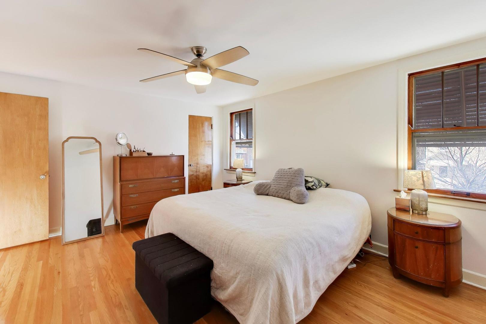 1811 Maple Avenue Berwyn, IL 60402 - Photo 18 of 31 a bedroom with a bed and wooden floor