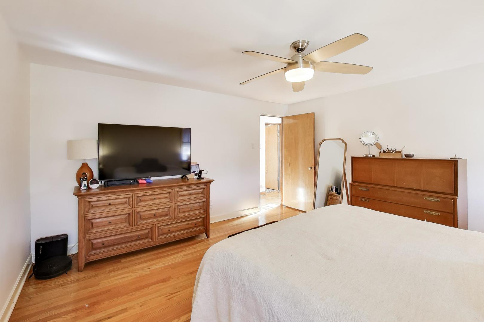 1811 Maple Avenue Berwyn, IL 60402 - Photo 19 of 31 a bedroom with a bed and a flat screen tv