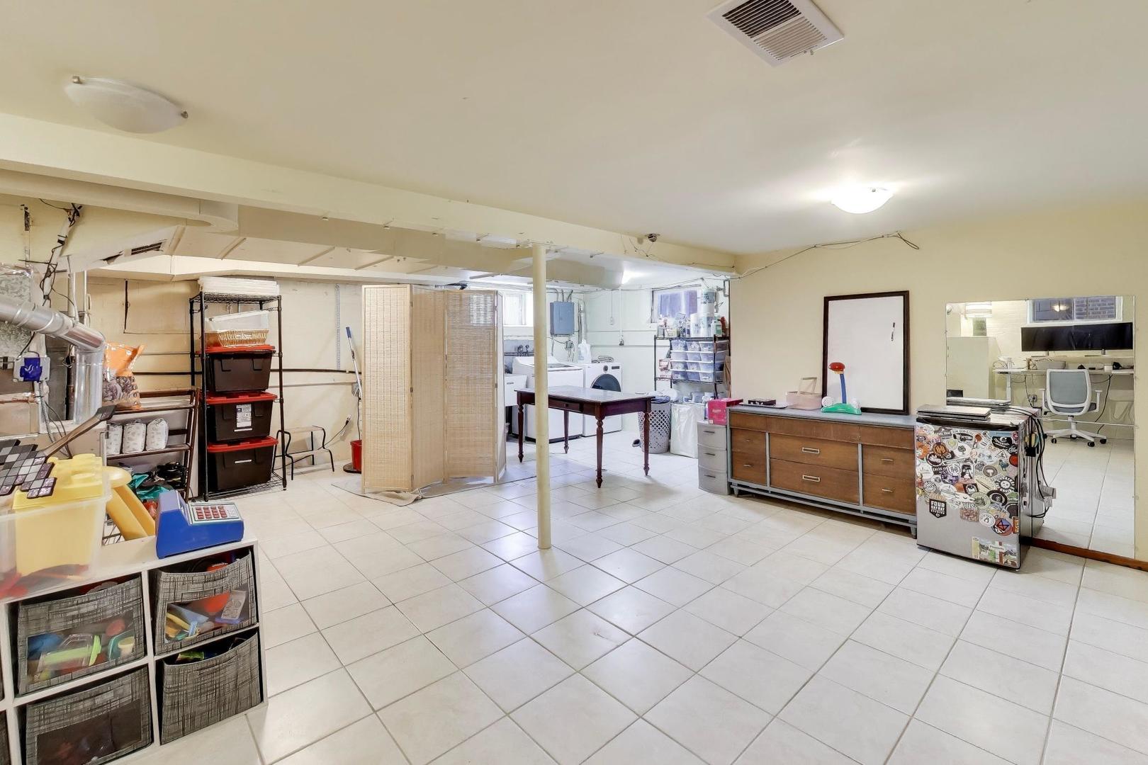 1811 Maple Avenue Berwyn, IL 60402 - Photo 25 of 31 a kitchen with stainless steel appliances kitchen island granite countertop a refrigerator and cabinets