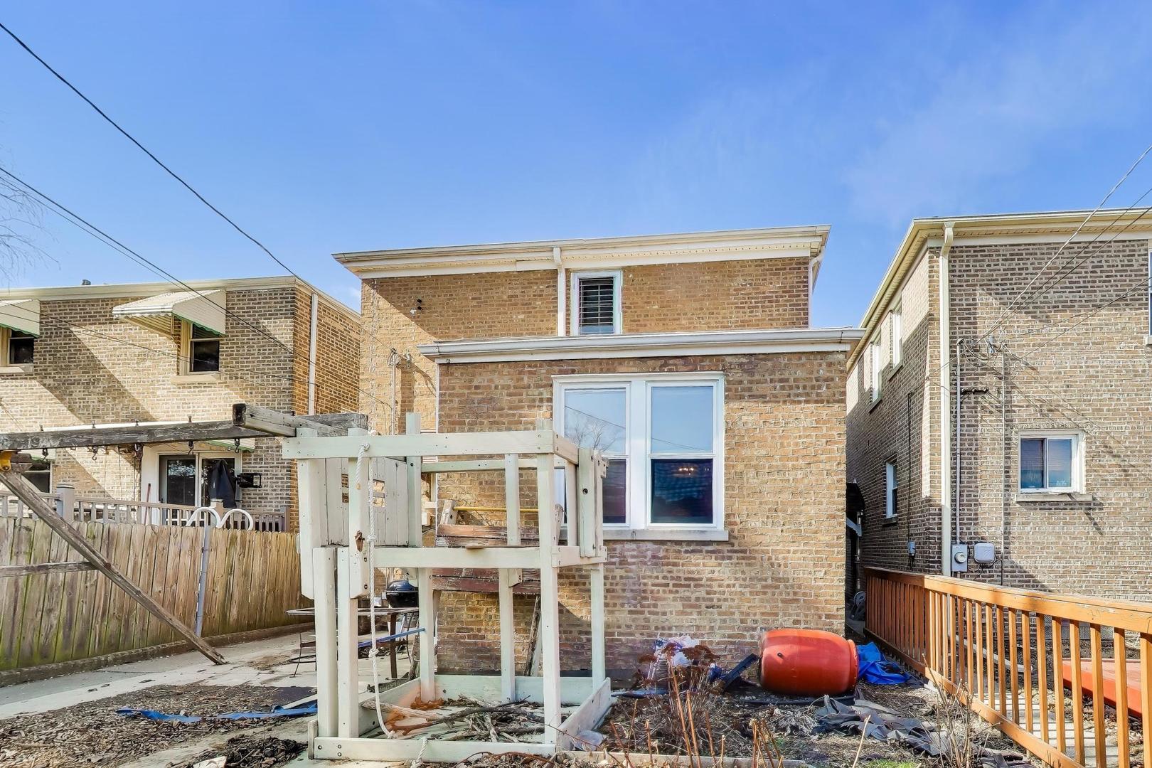 1811 Maple Avenue Berwyn, IL 60402 - Photo 28 of 31 a front view of a building with table and chairs