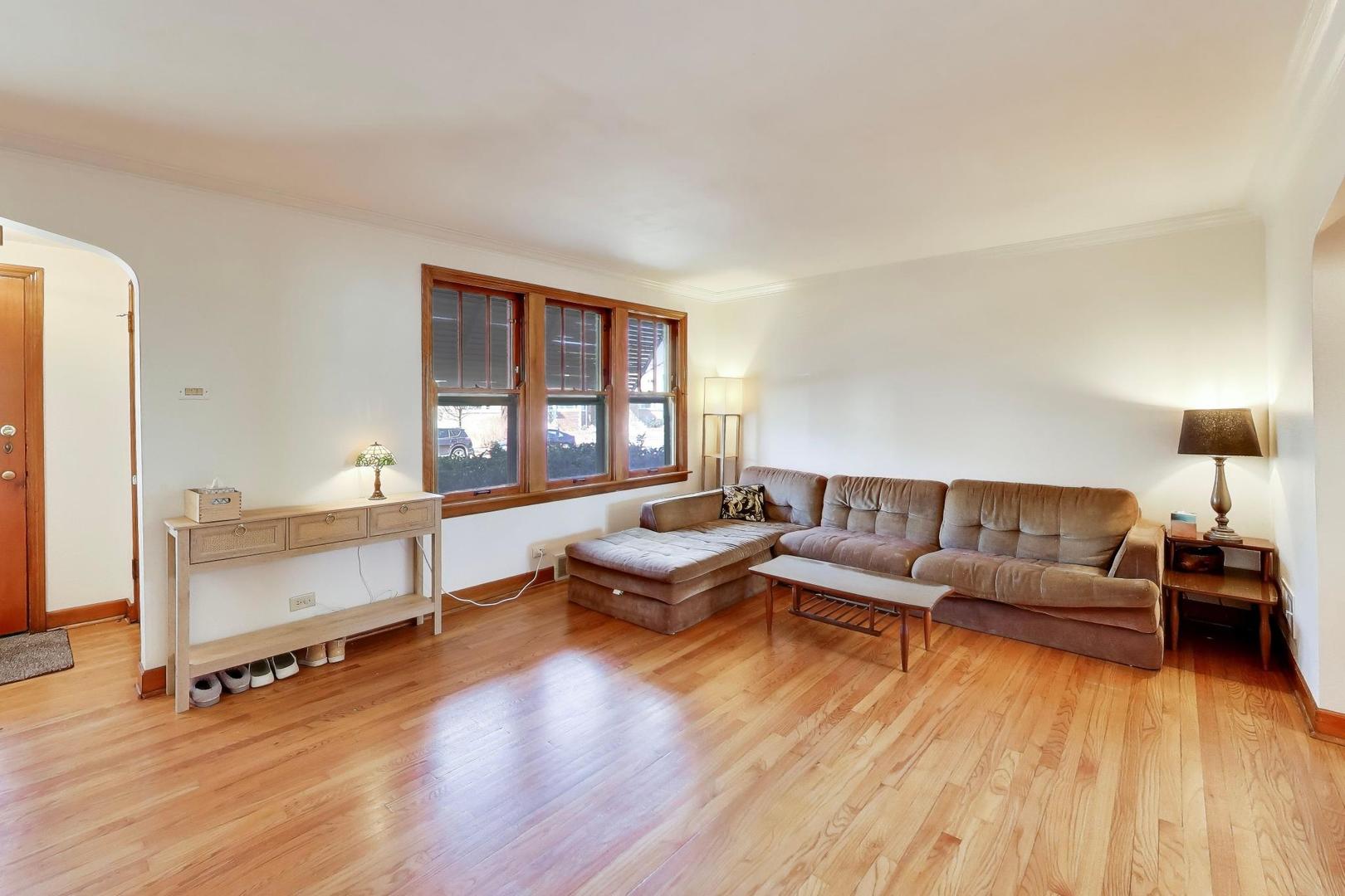 1811 Maple Avenue Berwyn, IL 60402 - Photo 4 of 31 a living room with furniture and a wooden floor