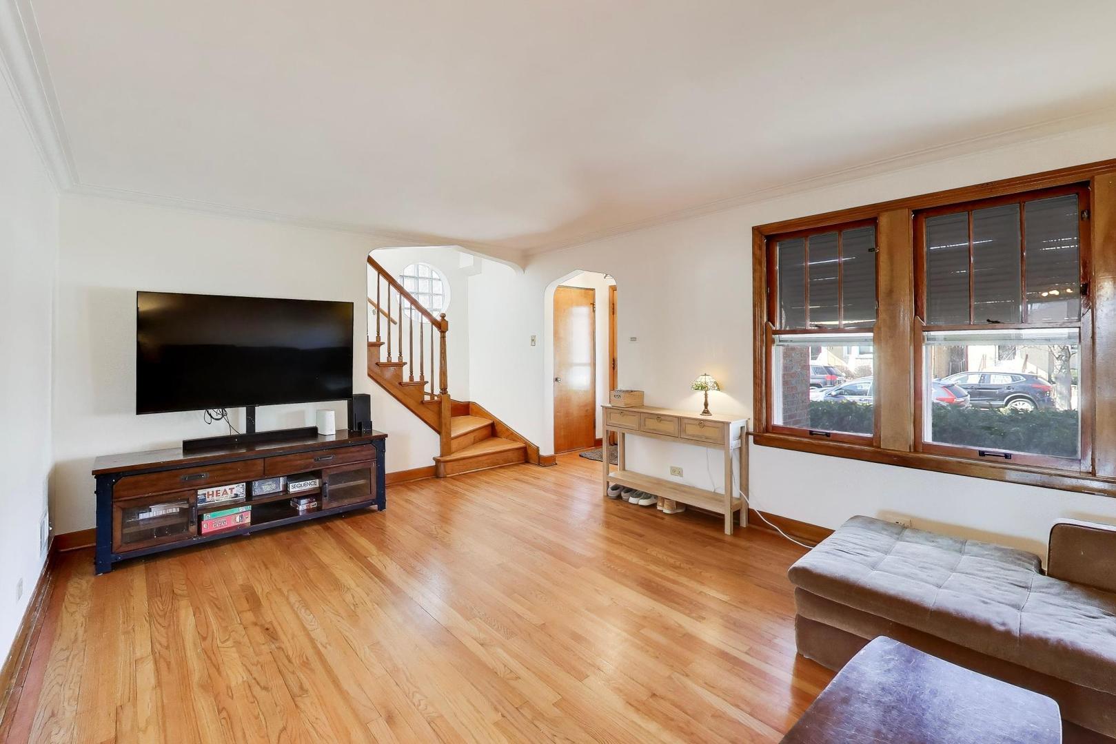 1811 Maple Avenue Berwyn, IL 60402 - Photo 6 of 31 a living room with furniture and a flat screen tv
