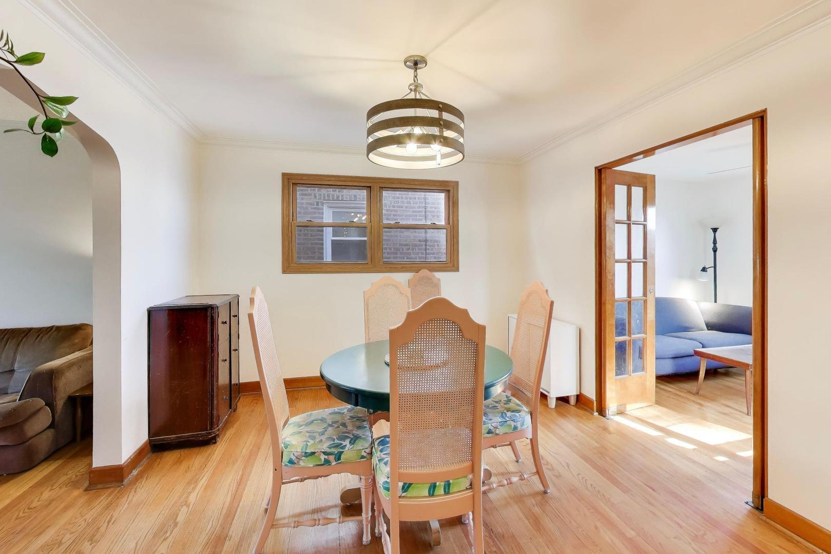 1811 Maple Avenue Berwyn, IL 60402 - Photo 8 of 31 a view of a dining room with furniture and wooden floor
