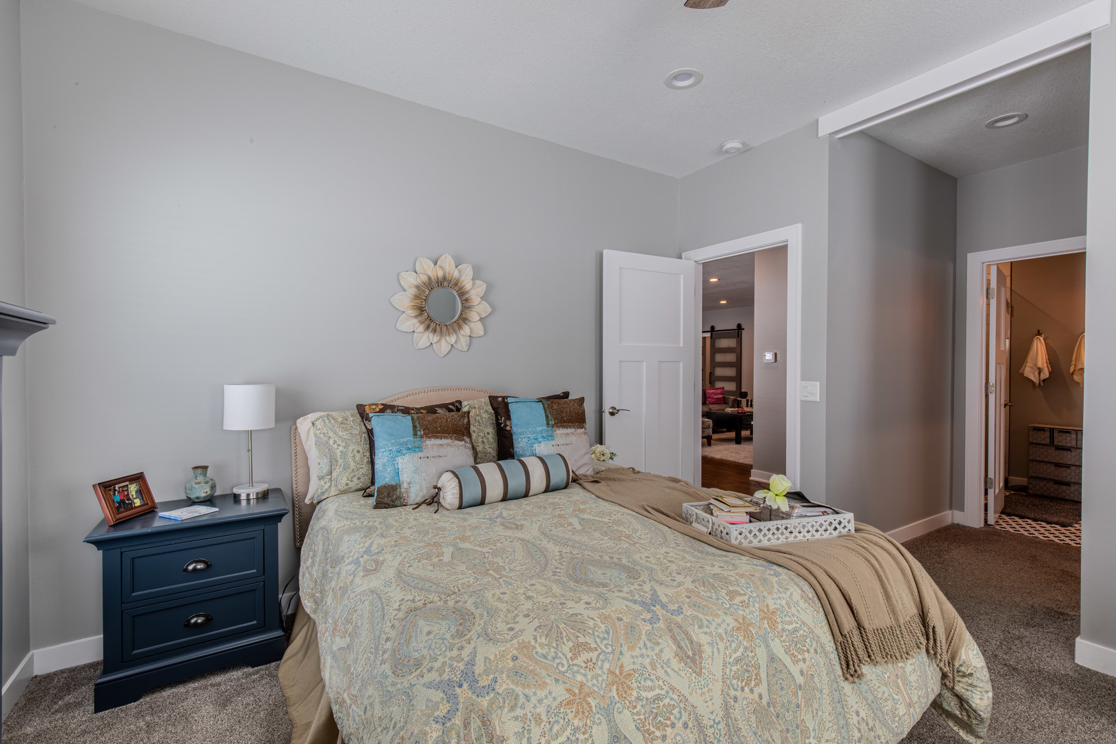 825 East Thompson Street Princeton, IL 61356 - Photo 15 of 26 a bedroom with a bed and a chandelier