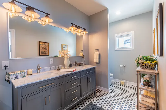 a bathroom with a shower and a sink