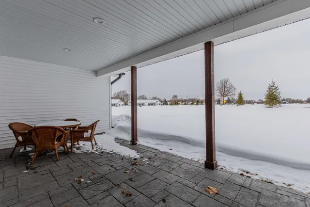 a backyard of a house with outdoor seating