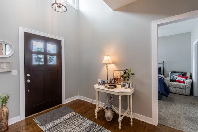 a bedroom with furniture and a window