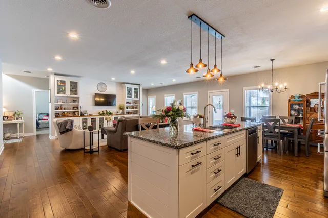 a large kitchen with lots of counter space and a sink