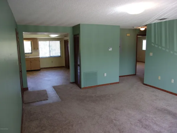 a view of a room with window and stairs