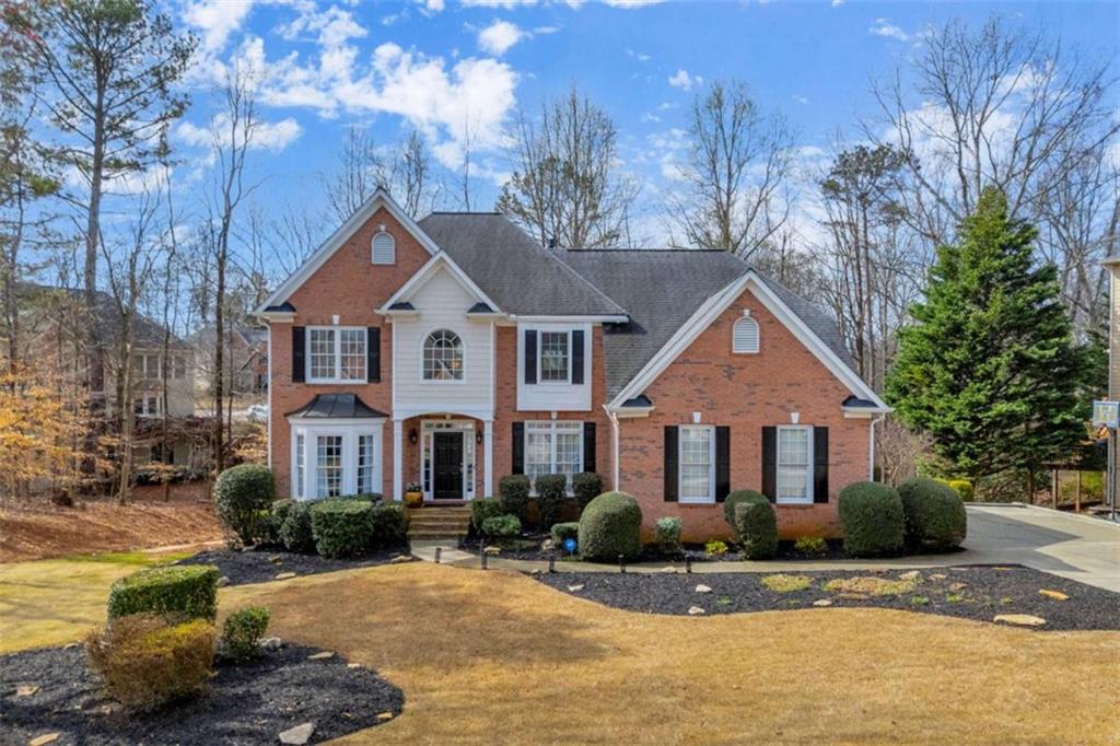 3540 Sentry View Trace Suwanee, GA 30024 - Photo 2 of 70 a front view of a house with a yard