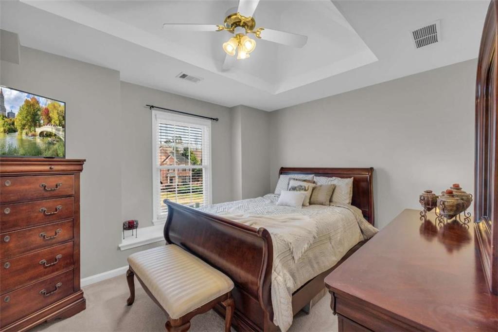 3540 Sentry View Trace Suwanee, GA 30024 - Photo 23 of 70 a bedroom with a bed and a dresser
