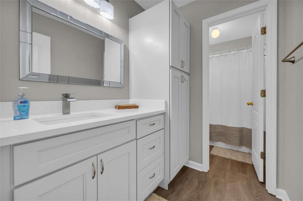 3540 Sentry View Trace Suwanee, GA 30024 - Photo 25 of 70 a en suite bathroom with a sink a mirror and a shower