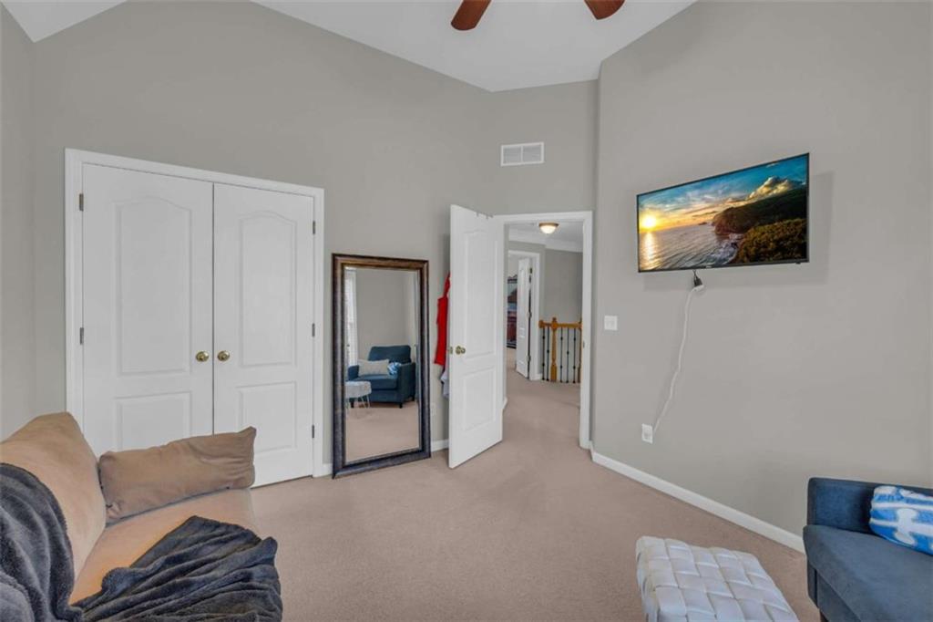 3540 Sentry View Trace Suwanee, GA 30024 - Photo 28 of 70 a living room with furniture and a flat screen tv