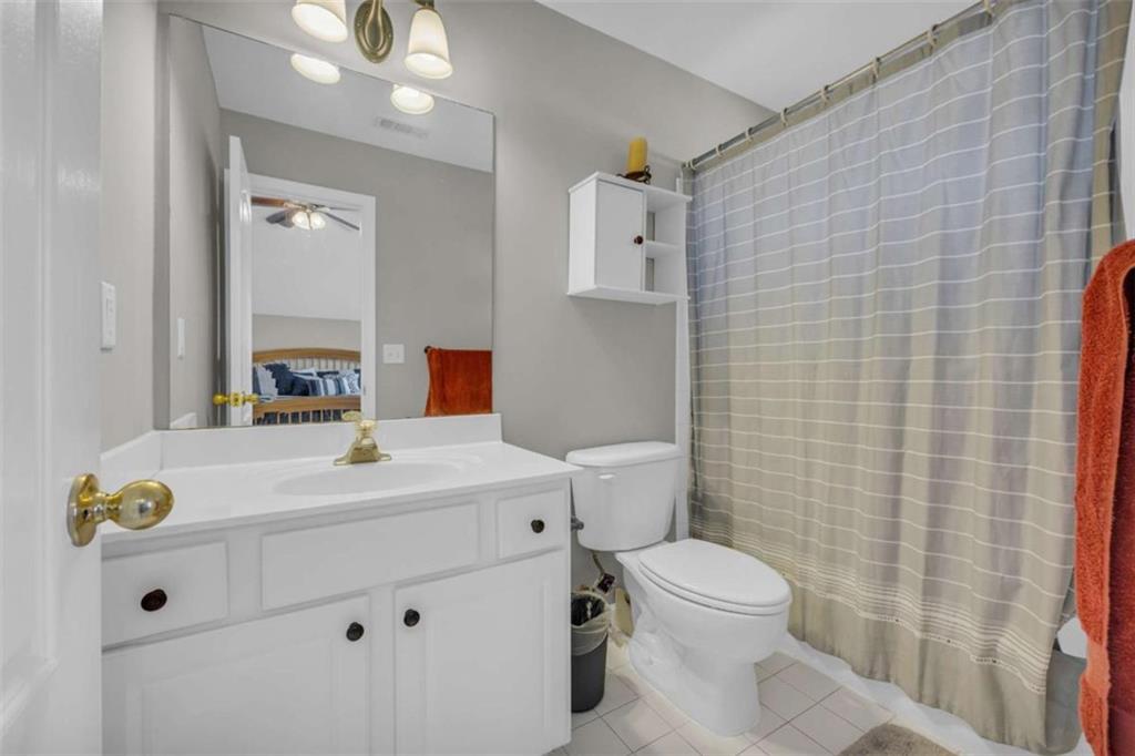 3540 Sentry View Trace Suwanee, GA 30024 - Photo 31 of 70 a bathroom with a sink a toilet and mirror