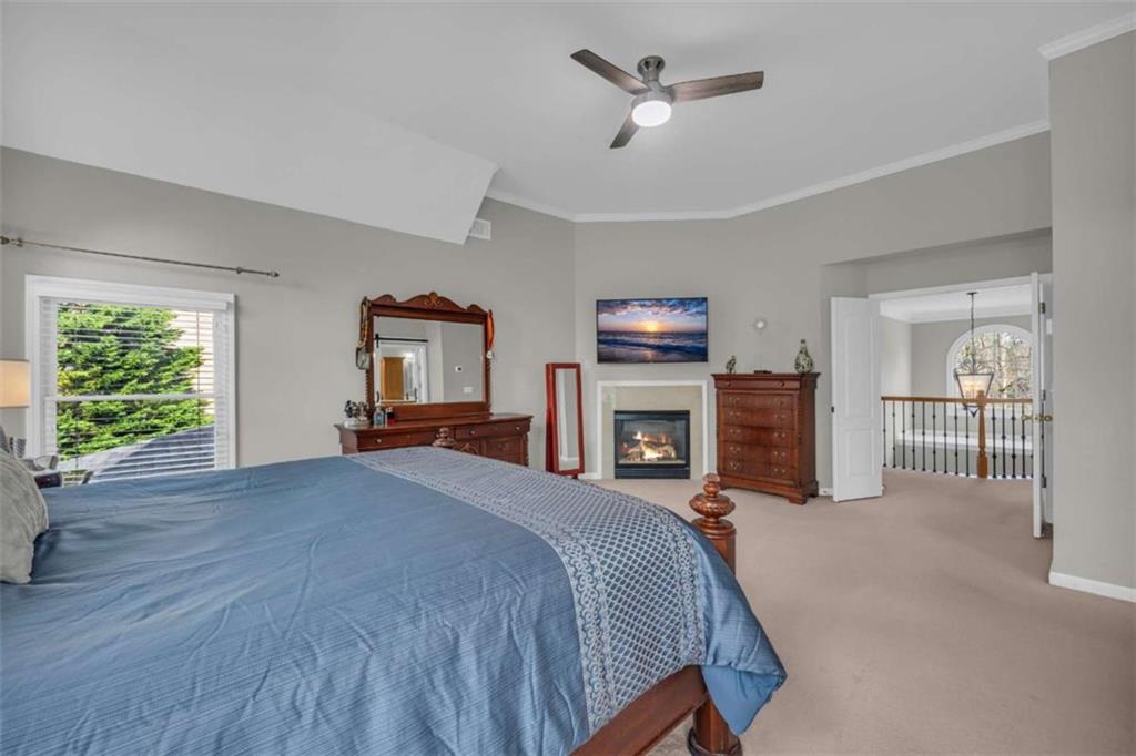 3540 Sentry View Trace Suwanee, GA 30024 - Photo 35 of 70 a bed room with a bed and ceiling fan