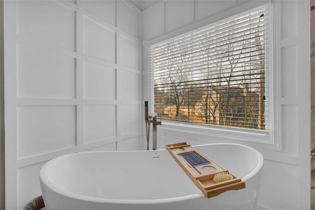 3540 Sentry View Trace Suwanee, GA 30024 - Photo 39 of 70 a bathroom with a tub and a window