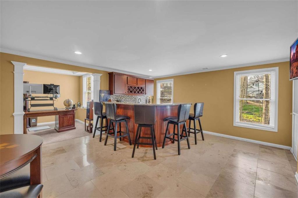 3540 Sentry View Trace Suwanee, GA 30024 - Photo 49 of 70 a view of a dining room with furniture window and outside view