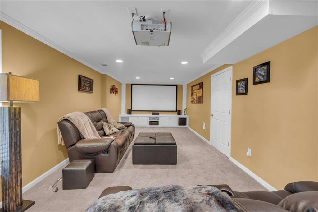 3540 Sentry View Trace Suwanee, GA 30024 - Photo 52 of 70 a living room with furniture and a flat screen tv