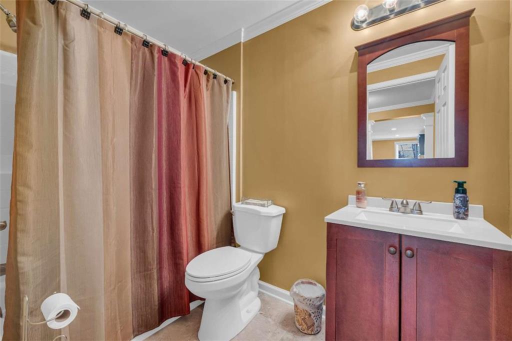 3540 Sentry View Trace Suwanee, GA 30024 - Photo 61 of 70 a bathroom with a toilet a sink and a mirror