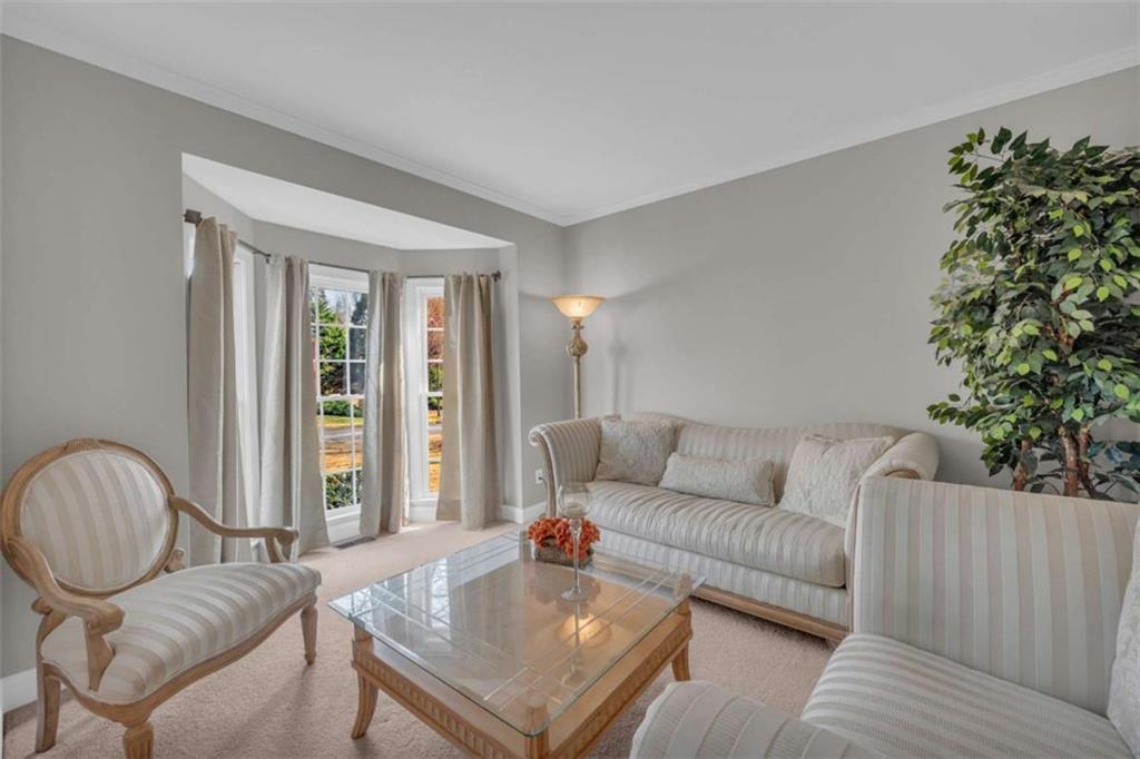 3540 Sentry View Trace Suwanee, GA 30024 - Photo 7 of 70 a living room with furniture and a potted plant