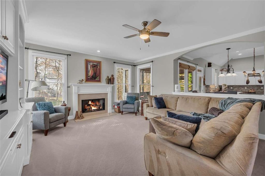 3540 Sentry View Trace Suwanee, GA 30024 - Photo 10 of 70 a living room with furniture and a fireplace