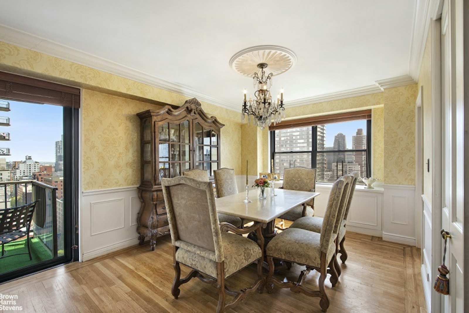 345 East 80th Street, Unit 19EF Manhattan, NY 10075 - Photo 16 of 32 a view of a dining room with furniture window and wooden floor