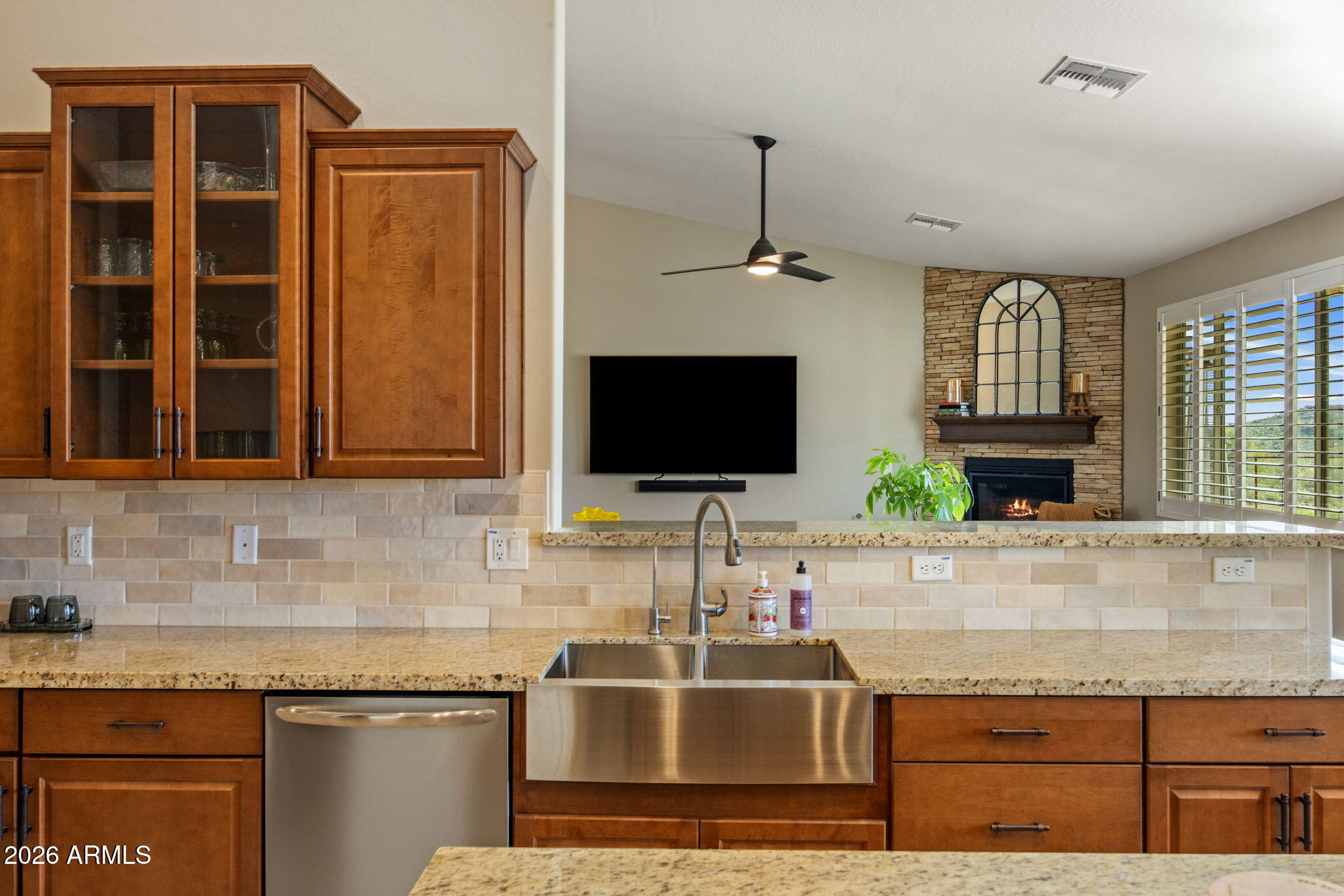 27412 North 170th Street Rio Verde, AZ 85263 - Photo 11 of 28 a kitchen with granite countertop a sink and a stove top oven