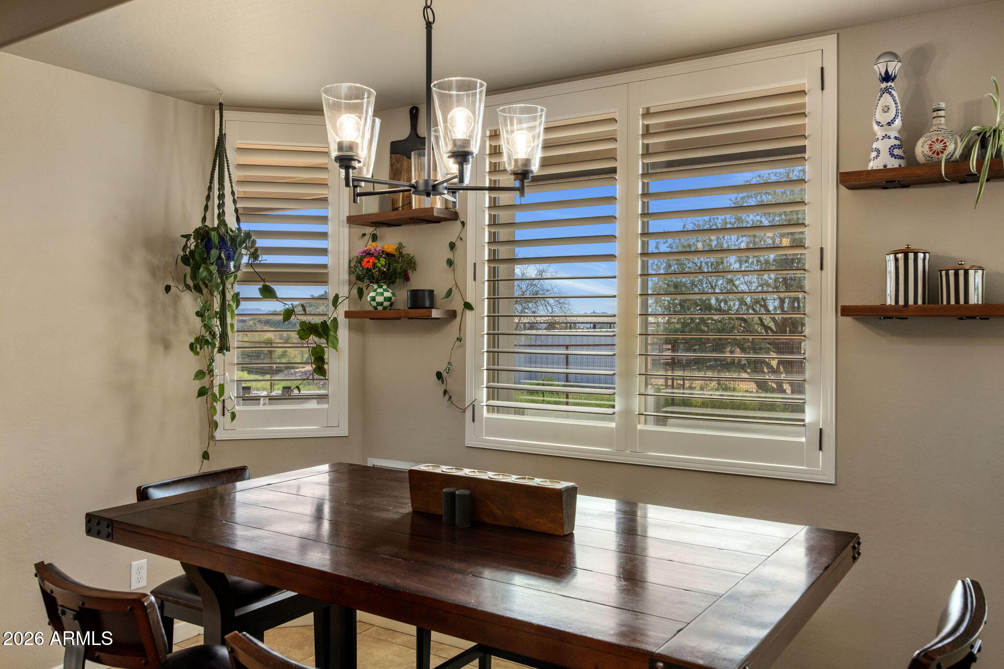27412 North 170th Street Rio Verde, AZ 85263 - Photo 12 of 28 a view of a dining room with furniture and a potted plant