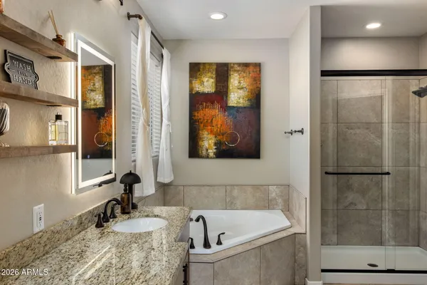 a bathroom with a tub and a sink