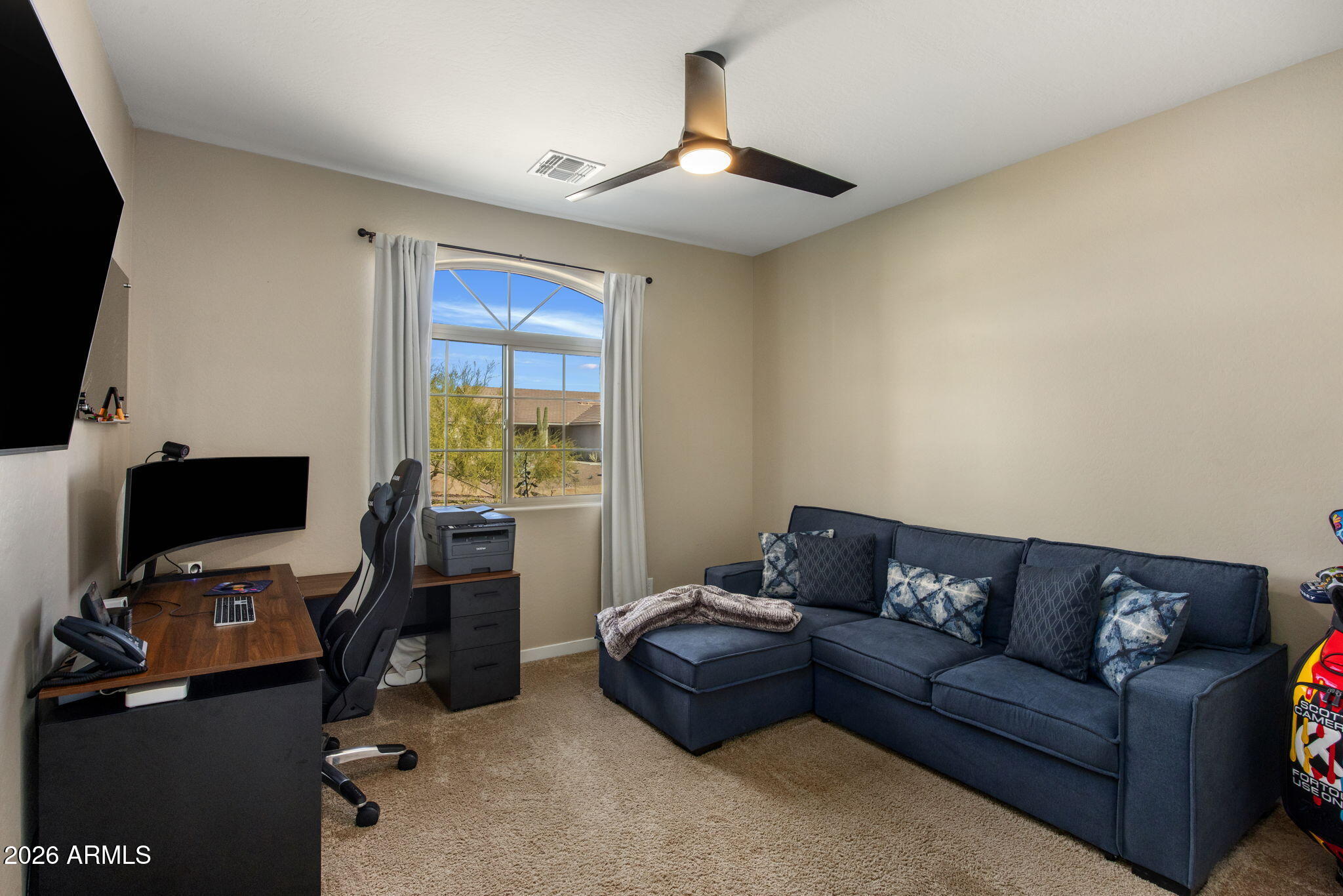 27412 North 170th Street Rio Verde, AZ 85263 - Photo 17 of 28 a living room with furniture and a flat screen tv