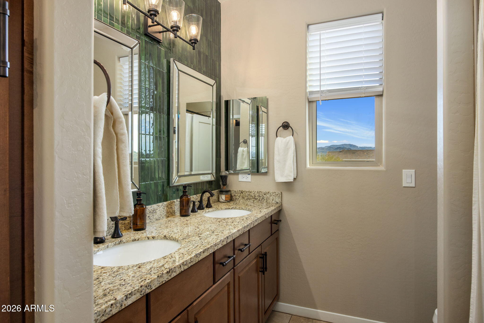 27412 North 170th Street Rio Verde, AZ 85263 - Photo 19 of 28 a bathroom with a granite countertop sink and a mirror