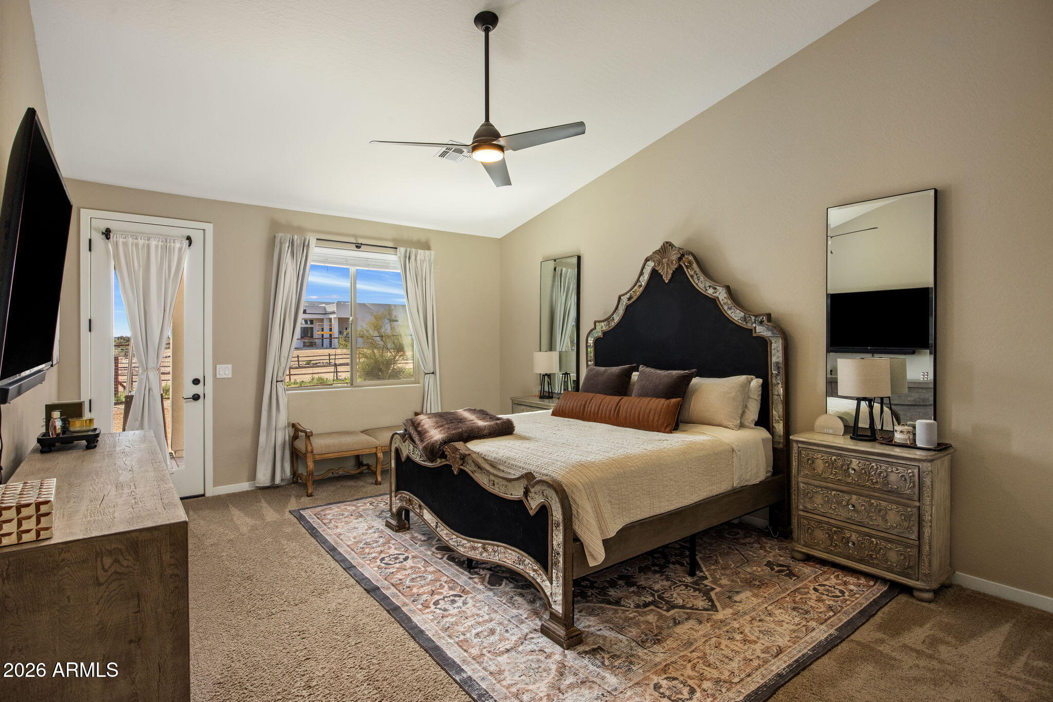 27412 North 170th Street Rio Verde, AZ 85263 - Photo 4 of 28 a bedroom with a large bed and a flat tv screen on dresser