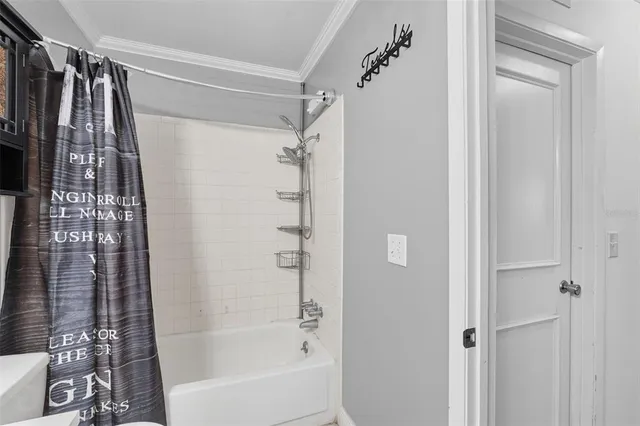 a bathroom with a shower curtain and a shower curtain