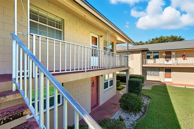 a balcony view with furniture in front of it