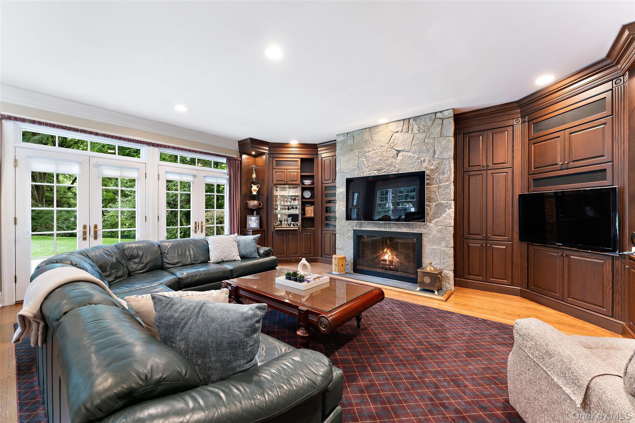 15 Sheldrake Road Scarsdale, NY 10583 - Photo 17 of 45 View of family room withe french doors to backyard