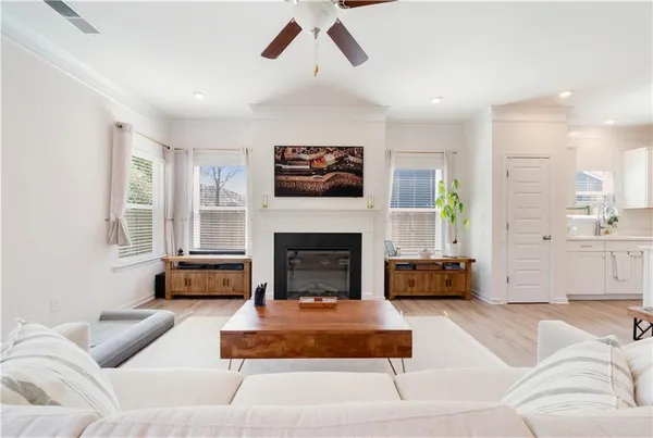 a kitchen with a sink a counter top space stainless steel appliances and cabinets