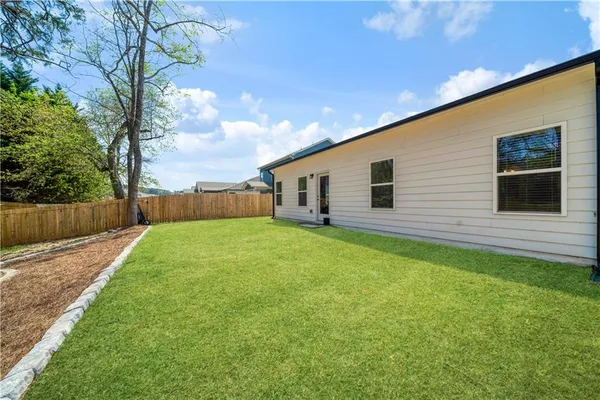 a kitchen with white cabinets and white stainless steel appliances