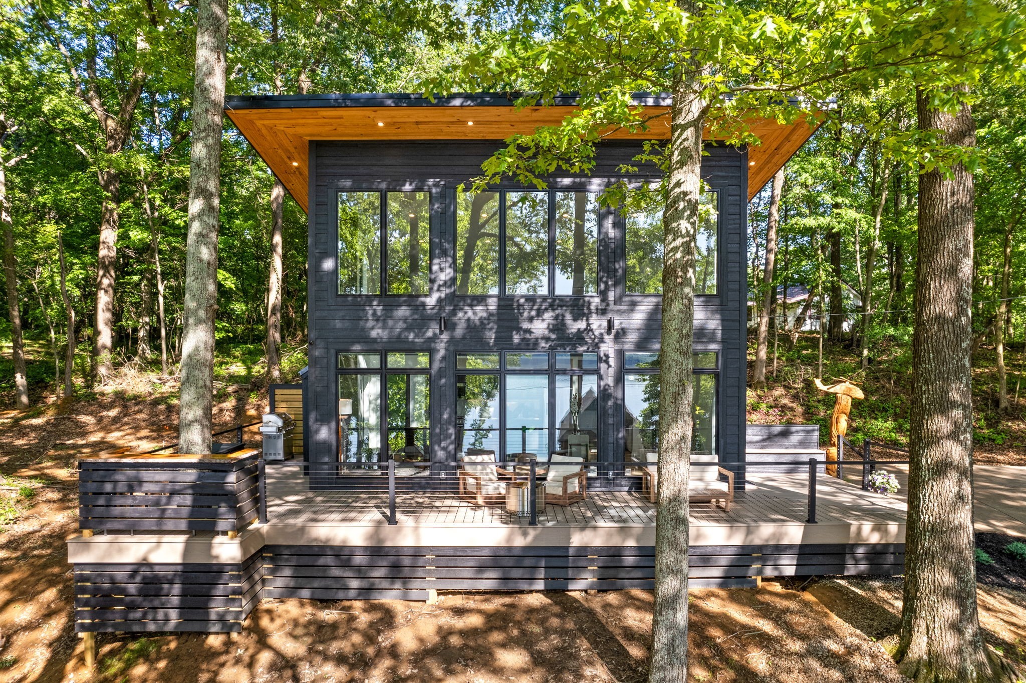 a view of house with yard and sitting area