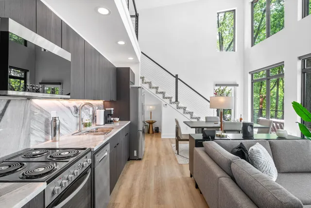 a living room with furniture and a table